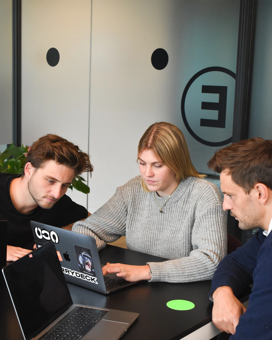 Team working together around a laptop