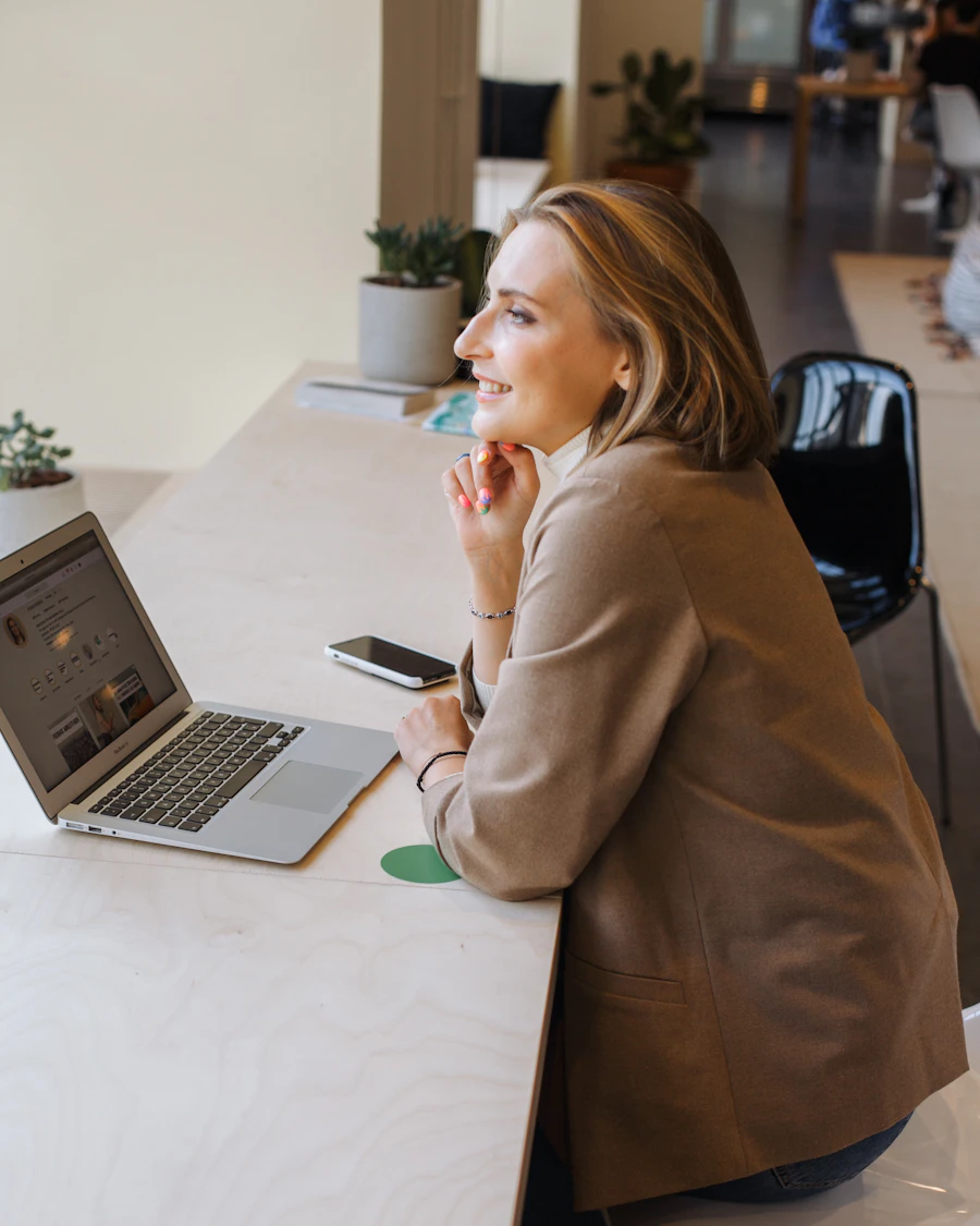 Business owner setting up the company workspace on a laptop